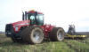 Tractor pulling the injection implement across a field